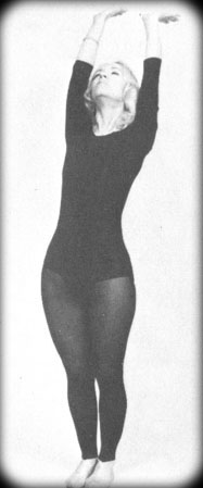 Eugenia in Tadasana variation for The Sun Salutation.